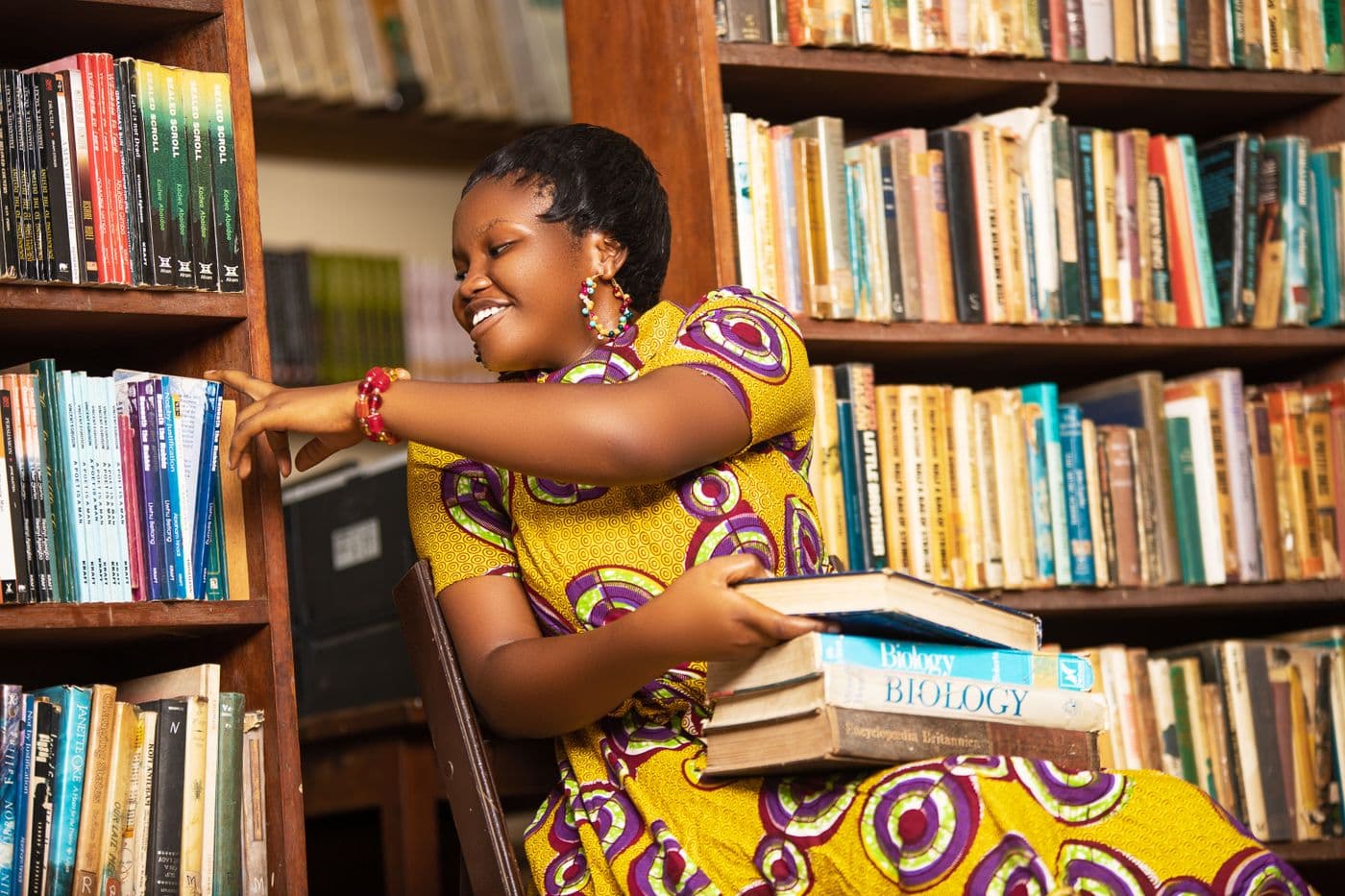 A student choosing a book in a school library