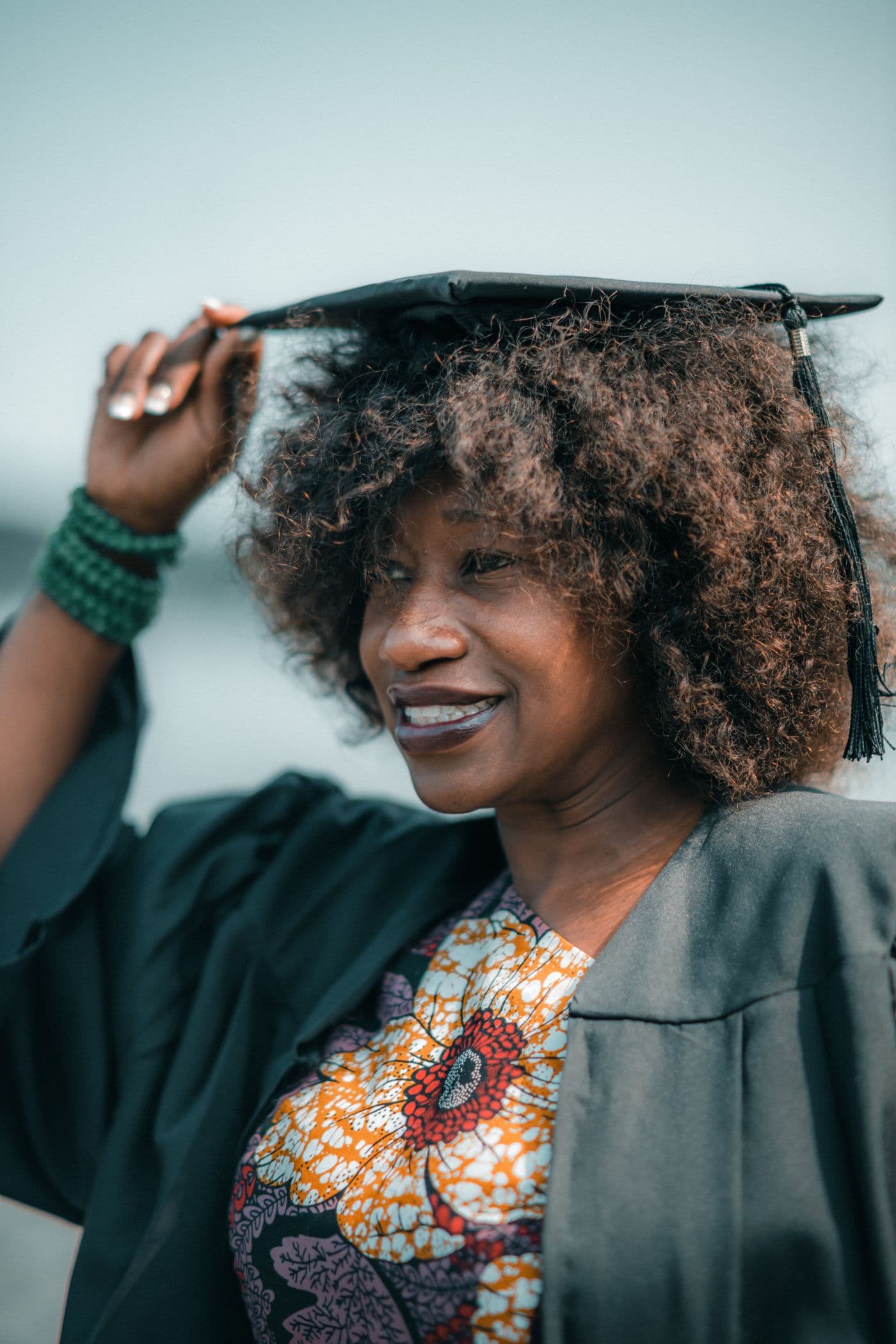A proud African graduate in cap and gown